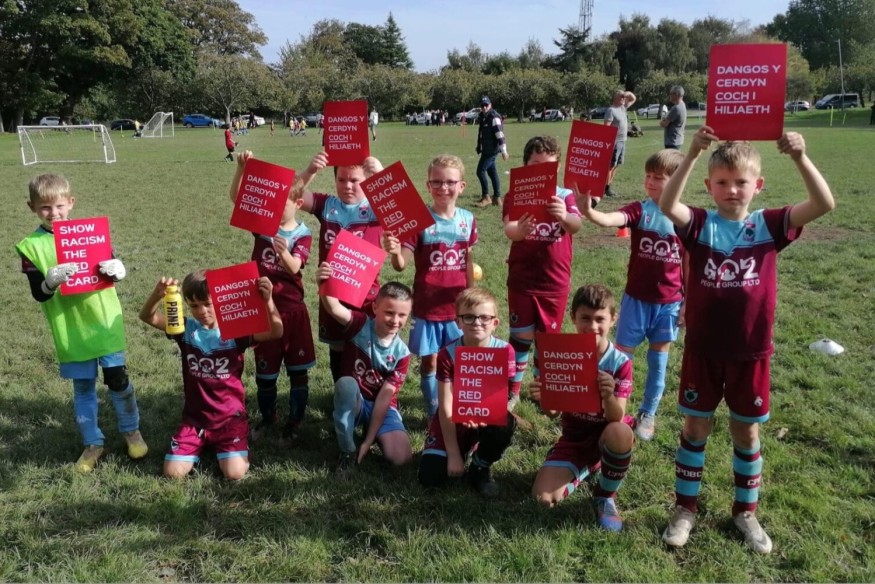 Bay's Junior football teams show 'Racism the Red Card'